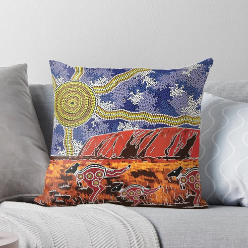 Pillow featuring vibrant aboriginal art design inspired by the iconic Uluru rock formation in the Australian outback.