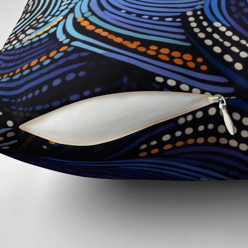 Decorative pillow featuring vibrant aboriginal-inspired artwork with waves and lava patterns.