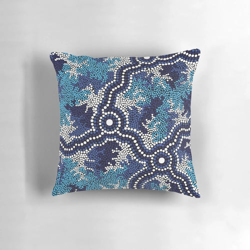 Vibrant blue aboriginal art pillow featuring traditional indigenous dot patterns and Australian wildlife like kangaroos and emus.