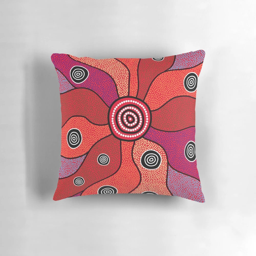 Vibrant aboriginal art pillow featuring traditional dot patterns and Australian native animals like kangaroo and emu