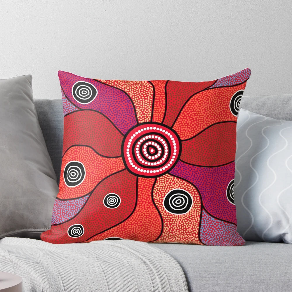 Vibrant aboriginal art pillow featuring traditional dot patterns and Australian native animals like kangaroo and emu