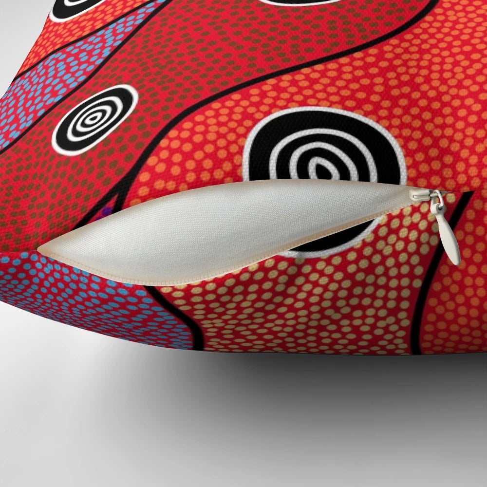 Vibrant aboriginal art pillow featuring traditional dot patterns and Australian native animals like kangaroo and emu