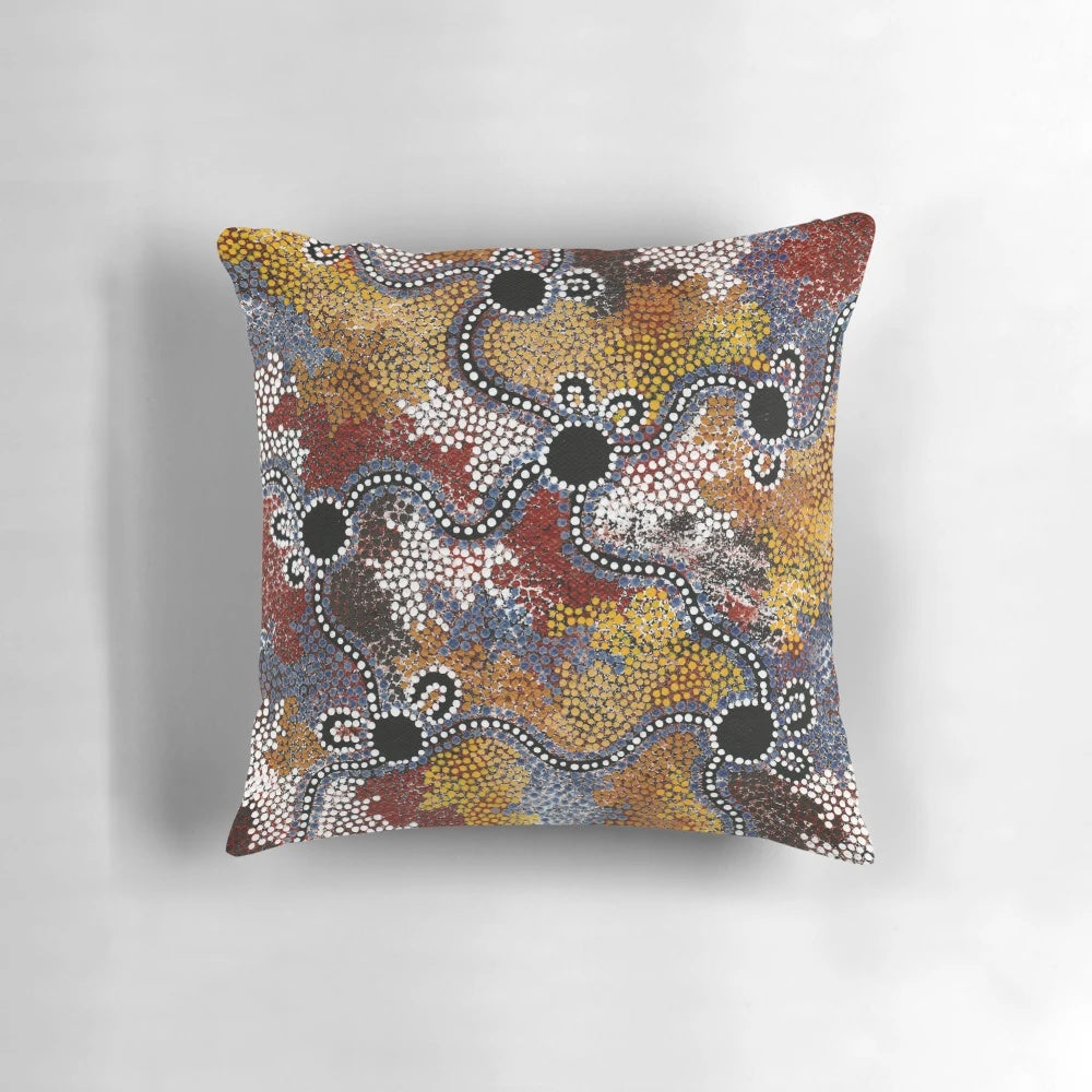 Pillow featuring vibrant aboriginal-inspired artwork with kangaroos, dots, and Australian landscape elements.