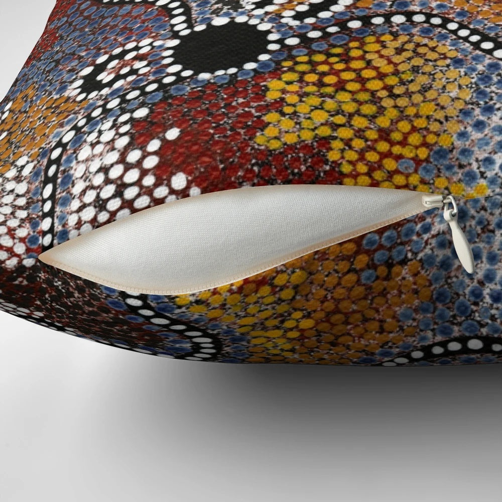 Pillow featuring vibrant aboriginal-inspired artwork with kangaroos, dots, and Australian landscape elements.