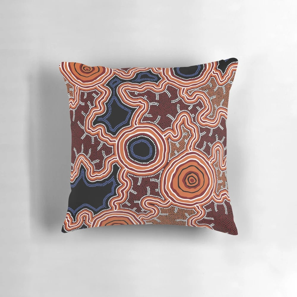 Authentic aboriginal-inspired blue and ochre art pillow featuring traditional Australian aboriginal dot and pathway designs