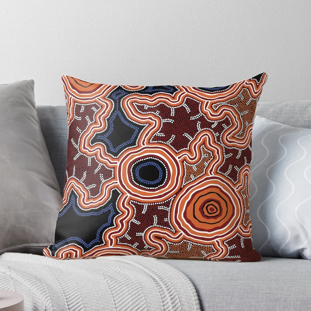 Authentic aboriginal-inspired blue and ochre art pillow featuring traditional Australian aboriginal dot and pathway designs