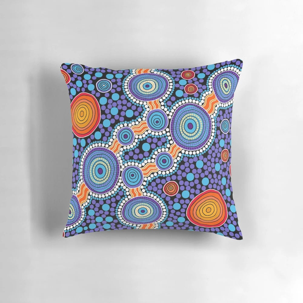 Authentic aboriginal-inspired blue pillow with traditional dot patterns and Australian wildlife imagery.