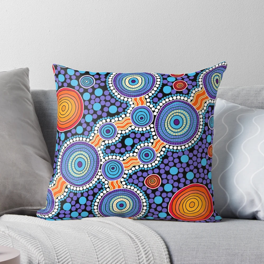 Authentic aboriginal-inspired blue pillow with traditional dot patterns and Australian wildlife imagery.
