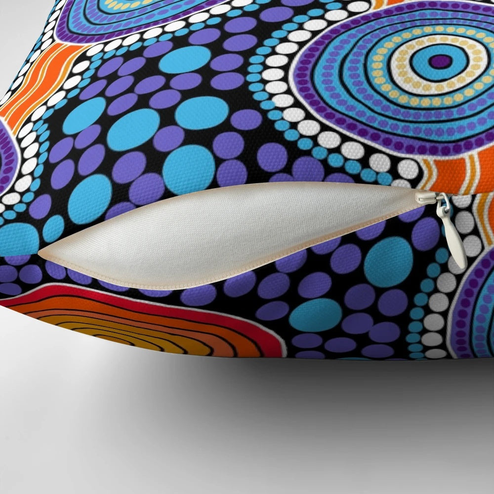 Authentic aboriginal-inspired blue pillow with traditional dot patterns and Australian wildlife imagery.