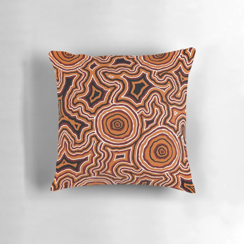 Authentic Aboriginal-inspired pillow design featuring traditional dot patterns and indigenous motifs.