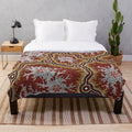 Plush blanket featuring an aboriginal-inspired mountains design