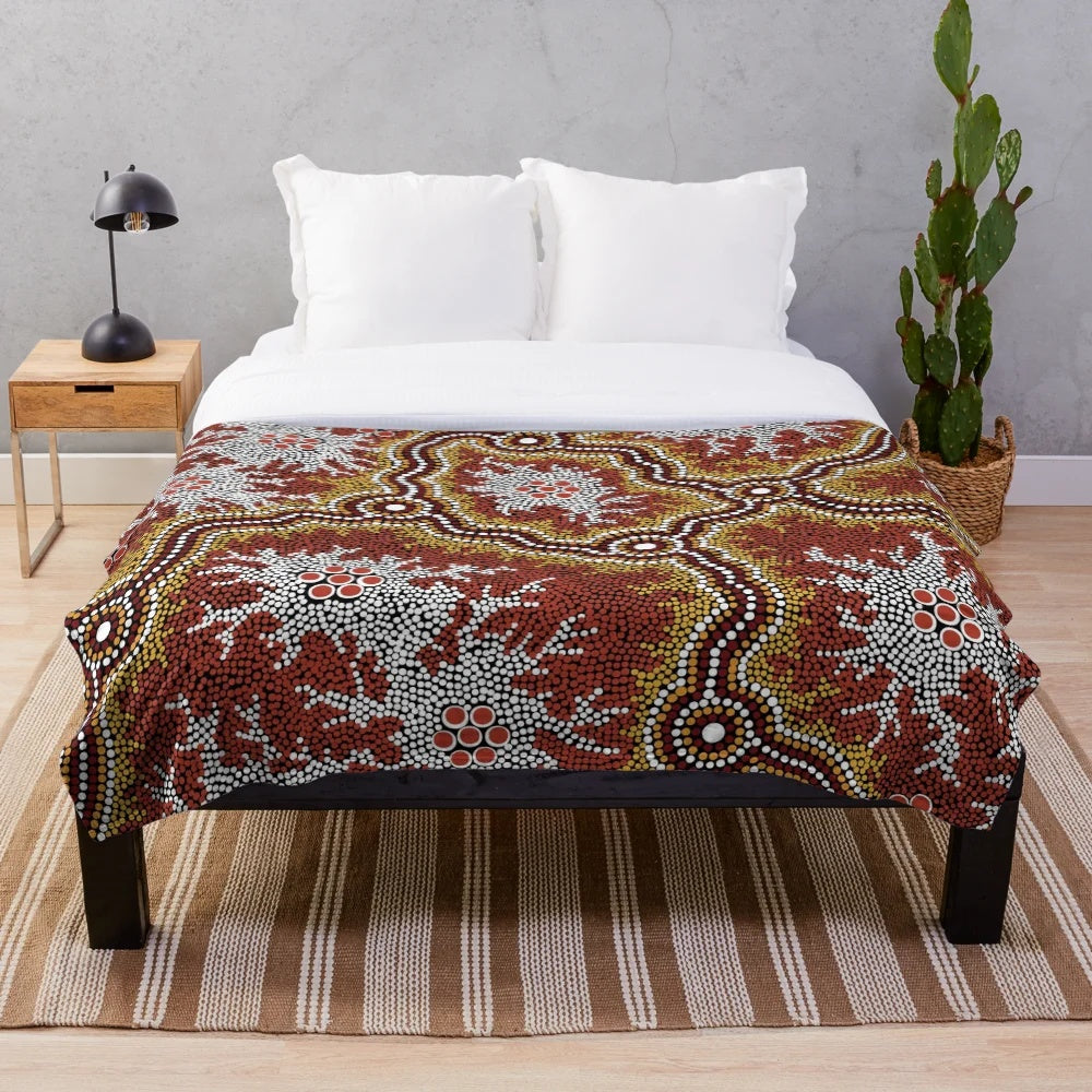 Plush blanket featuring an aboriginal-inspired mountains design