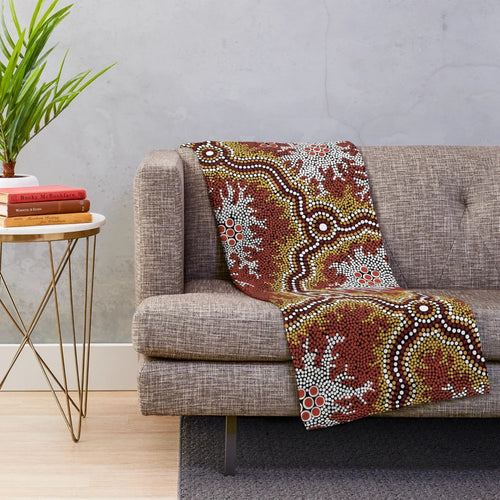 Plush blanket featuring an aboriginal-inspired mountains design