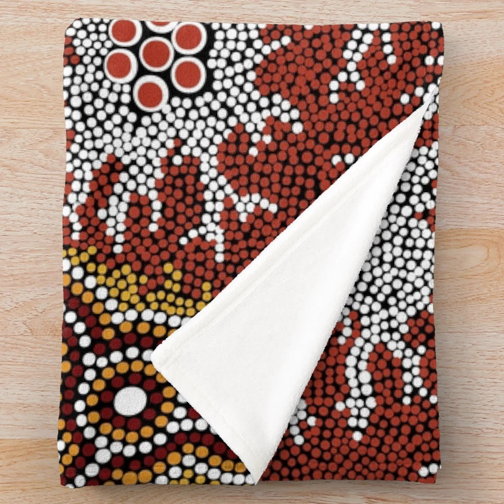 Plush blanket featuring an aboriginal-inspired mountains design