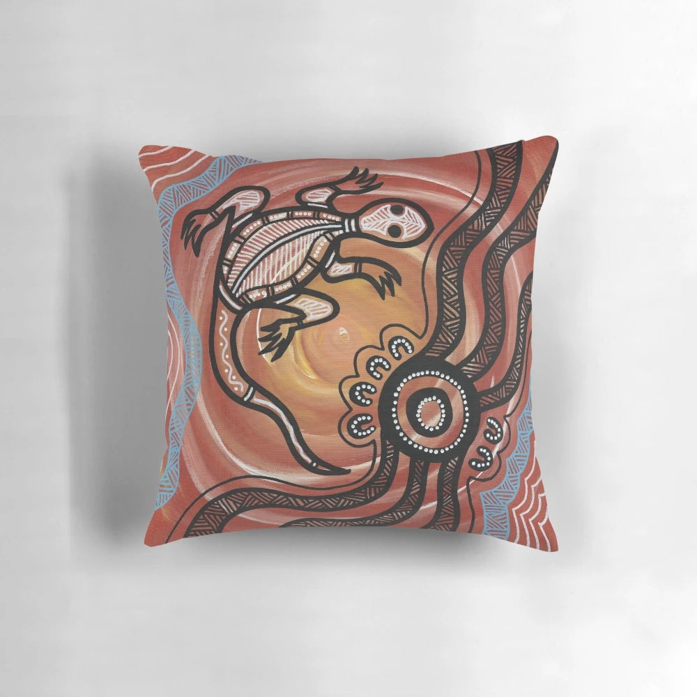 Vibrant acrylic painting of a lizard/goanna on a decorative throw pillow, showcasing authentic aboriginal art from Australia.