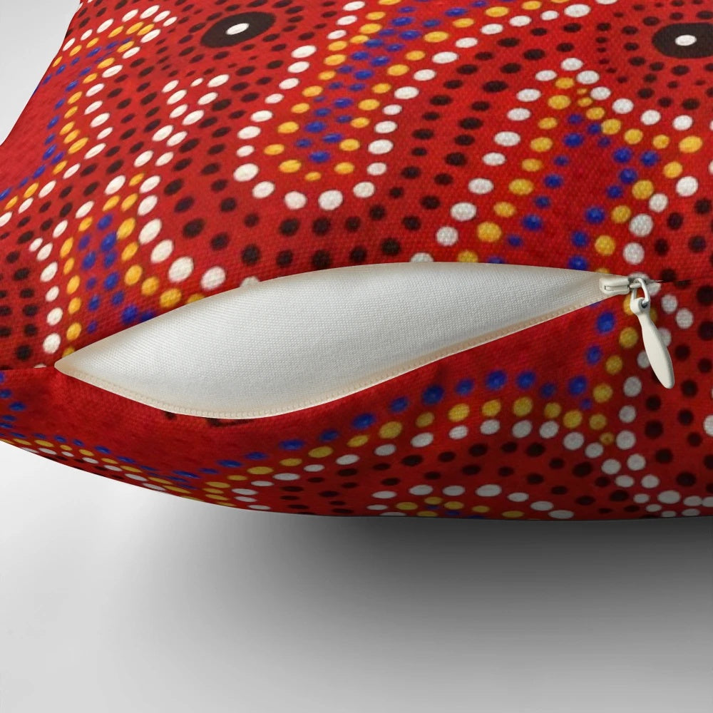Vibrant aboriginal dot painting artwork on a comfortable throw pillow