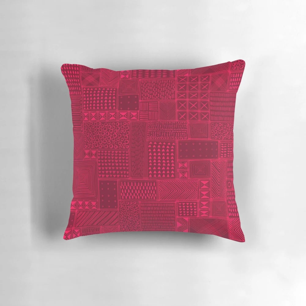A vibrant red and black tribal-inspired mud cloth design decorative pillow for African-themed home decor.