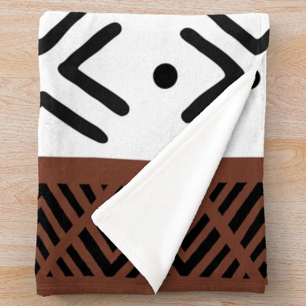 Soft, plush blanket with authentic African tribal bogolan pattern