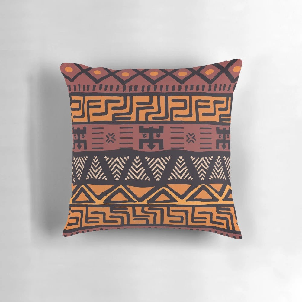Throw pillow featuring an authentic African tribal mudcloth pattern in earth tones