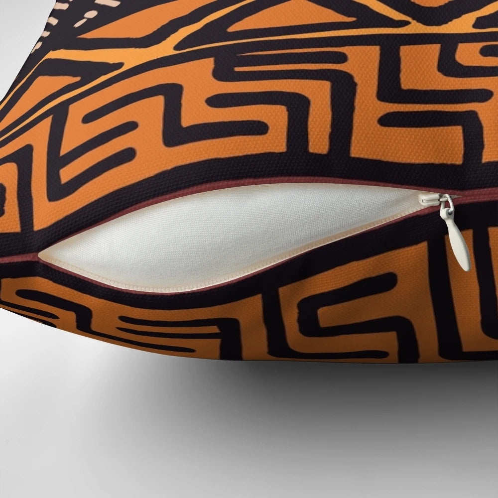 Throw pillow featuring an authentic African tribal mudcloth pattern in earth tones