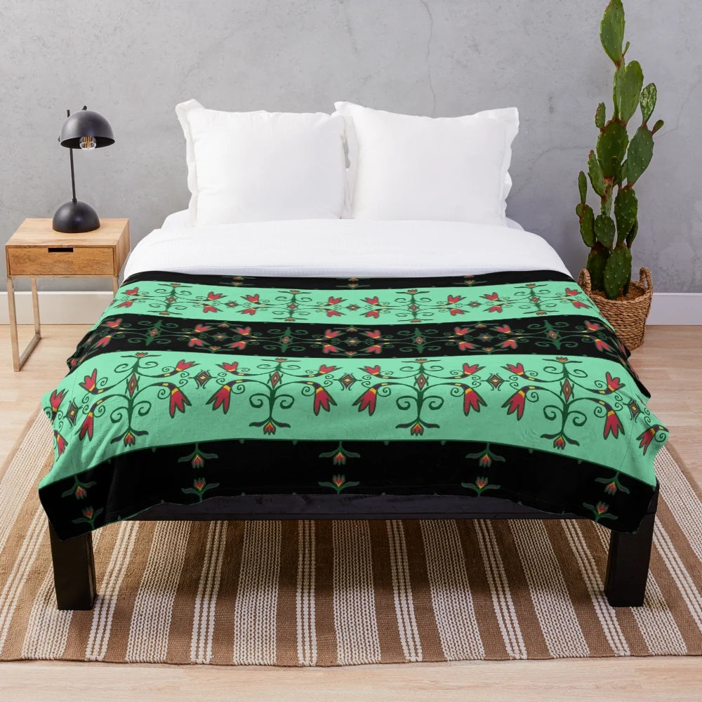 Plush blanket featuring Anishinaabe-inspired floral design