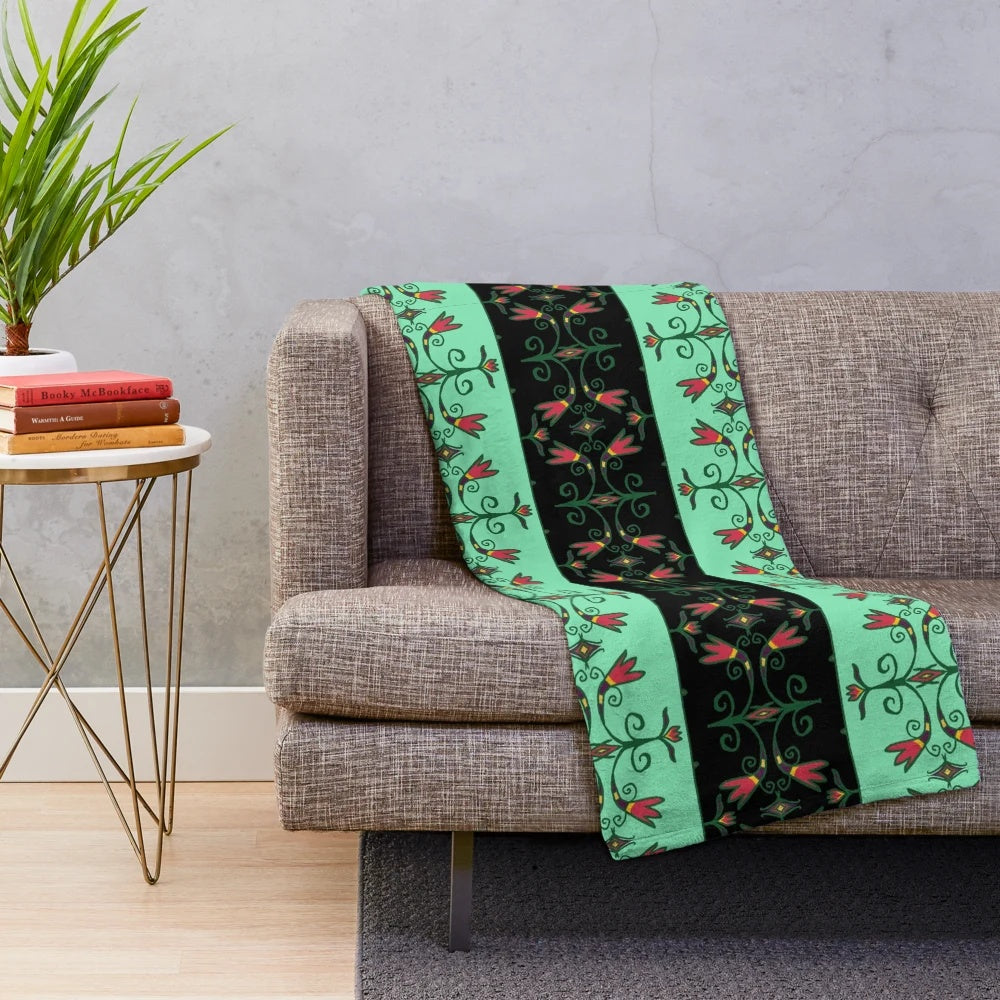 Plush blanket featuring Anishinaabe-inspired floral design