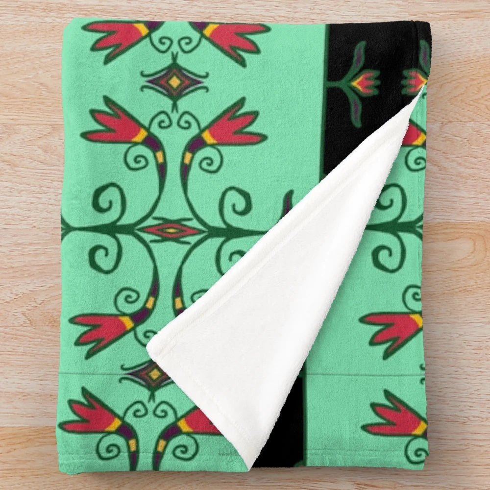 Plush blanket featuring Anishinaabe-inspired floral design