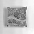 Vibrant aboriginal dot painting design on a soft, decorative throw pillow