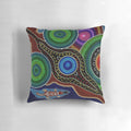 Colorful Australian aboriginal dot painting style design featuring a playful platypus on a soft, comfortable pillow.