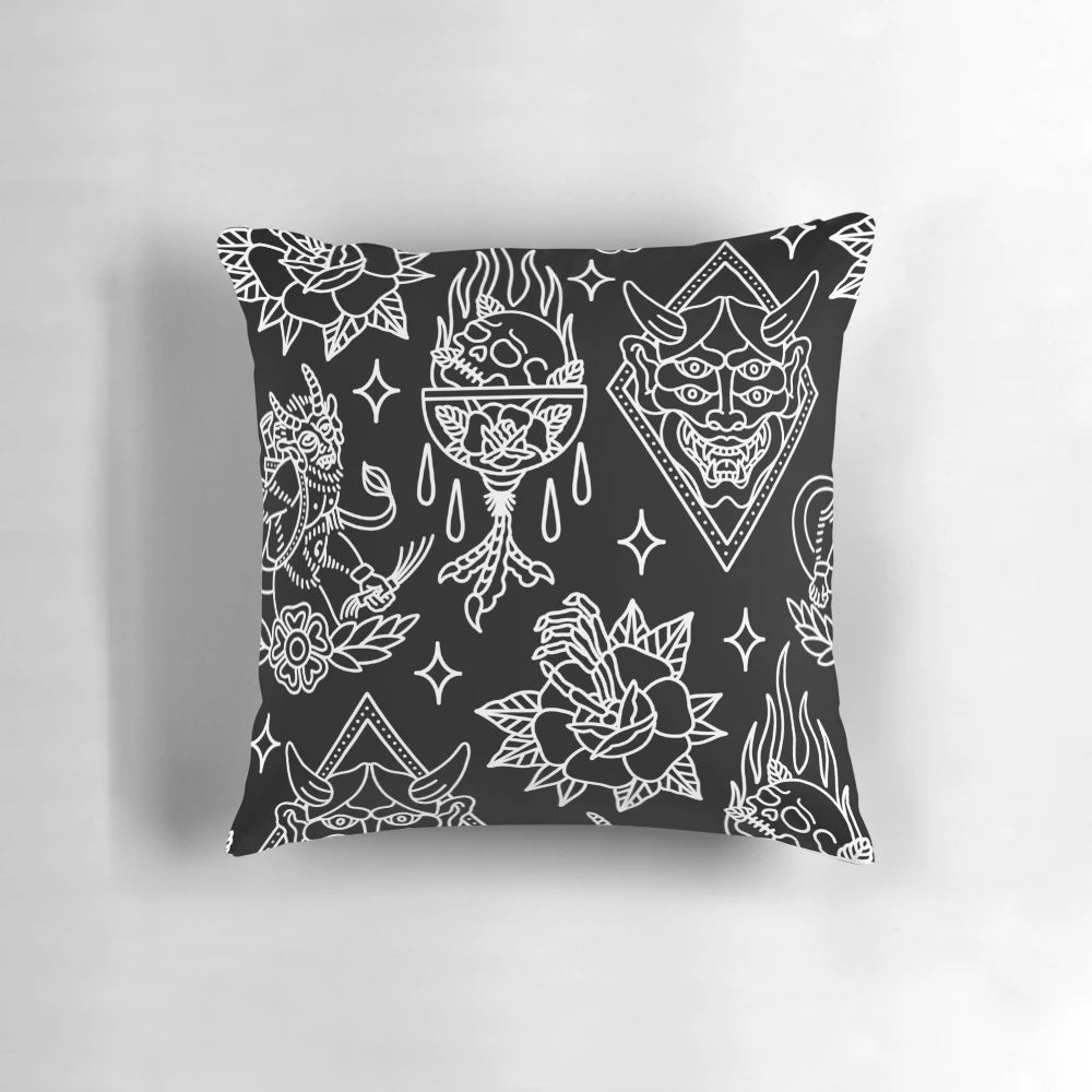 A black and white traditional tattoo flash pattern pillow for gothic and punk bedroom or home decor.