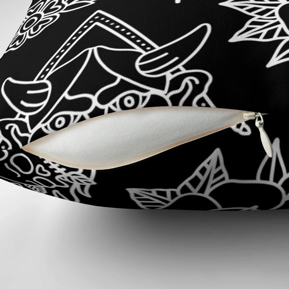 A black and white traditional tattoo flash pattern pillow for gothic and punk bedroom or home decor.
