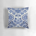 Blue and white delft tile pattern pillow with floral design, showcasing the traditional Dutch culture