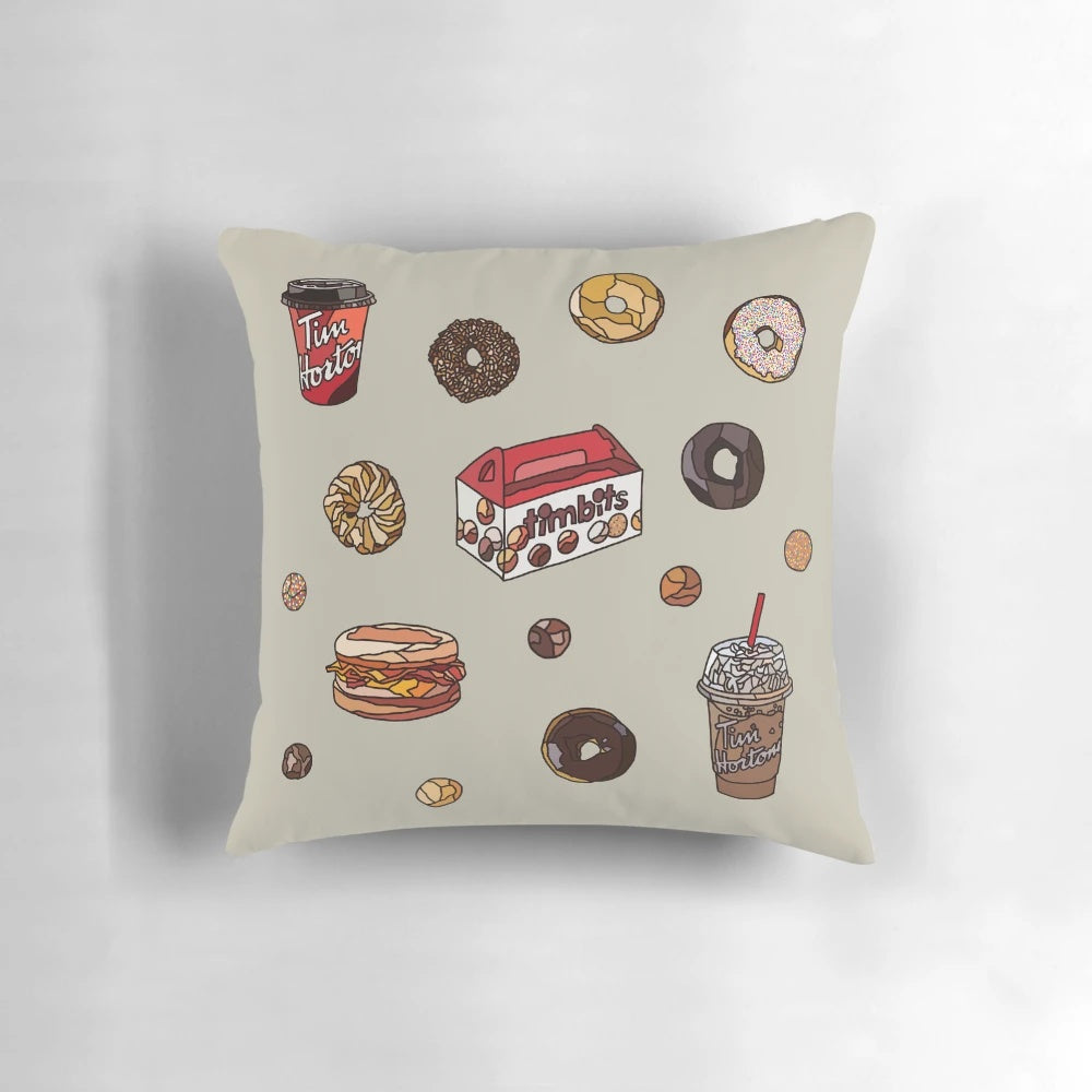 A cozy pillow featuring the iconic Canadian Timbits donuts from Tim Hortons.