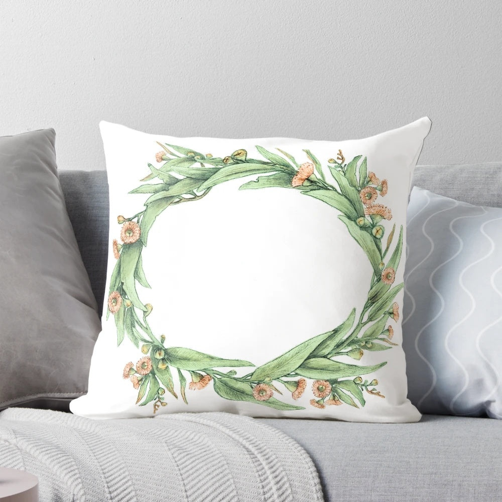 Eucalyptus wreath on a neutral-colored pillow, creating a natural and botanical home accent.