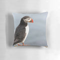 Decorative throw pillow featuring a stunning photograph of a puffin in its natural Icelandic habitat