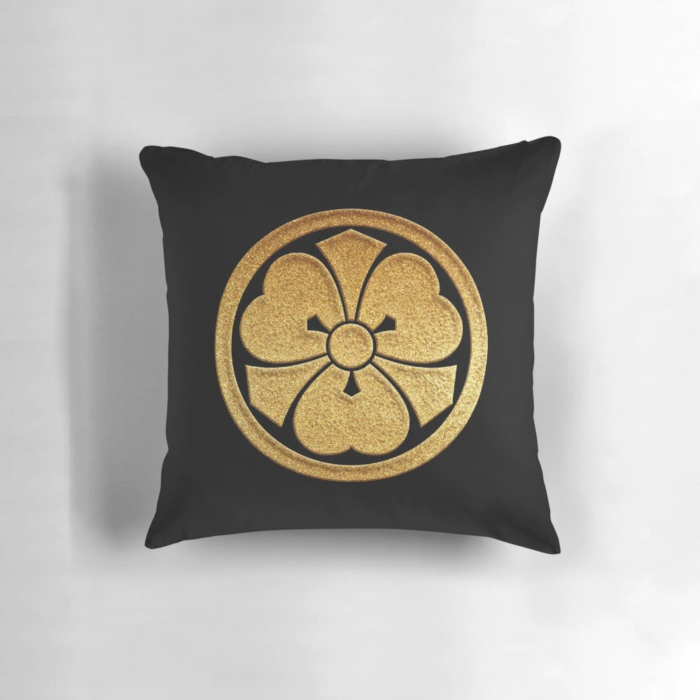 Gold seal pillow with Kenkatabami kamon, a traditional Japanese clan crest featuring wood sorrel and swords.