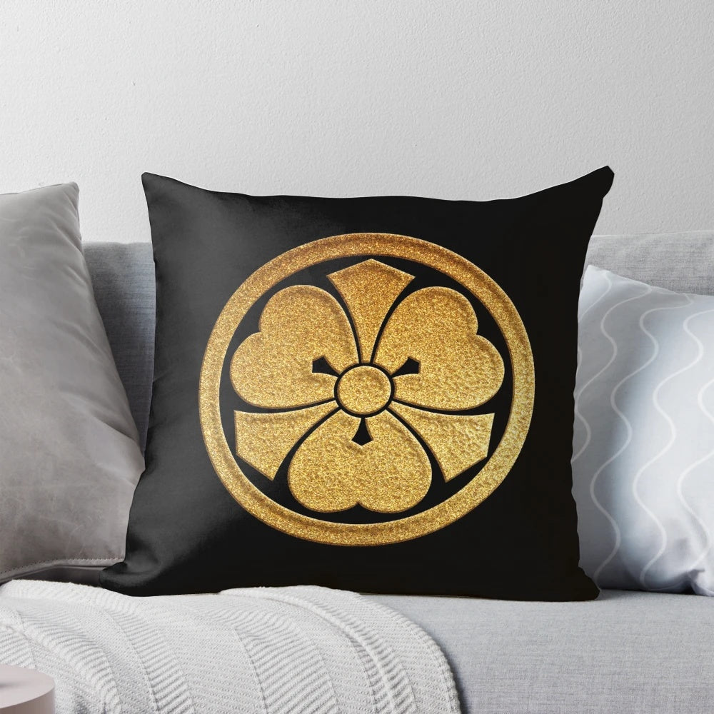 Gold seal pillow with Kenkatabami kamon, a traditional Japanese clan crest featuring wood sorrel and swords.