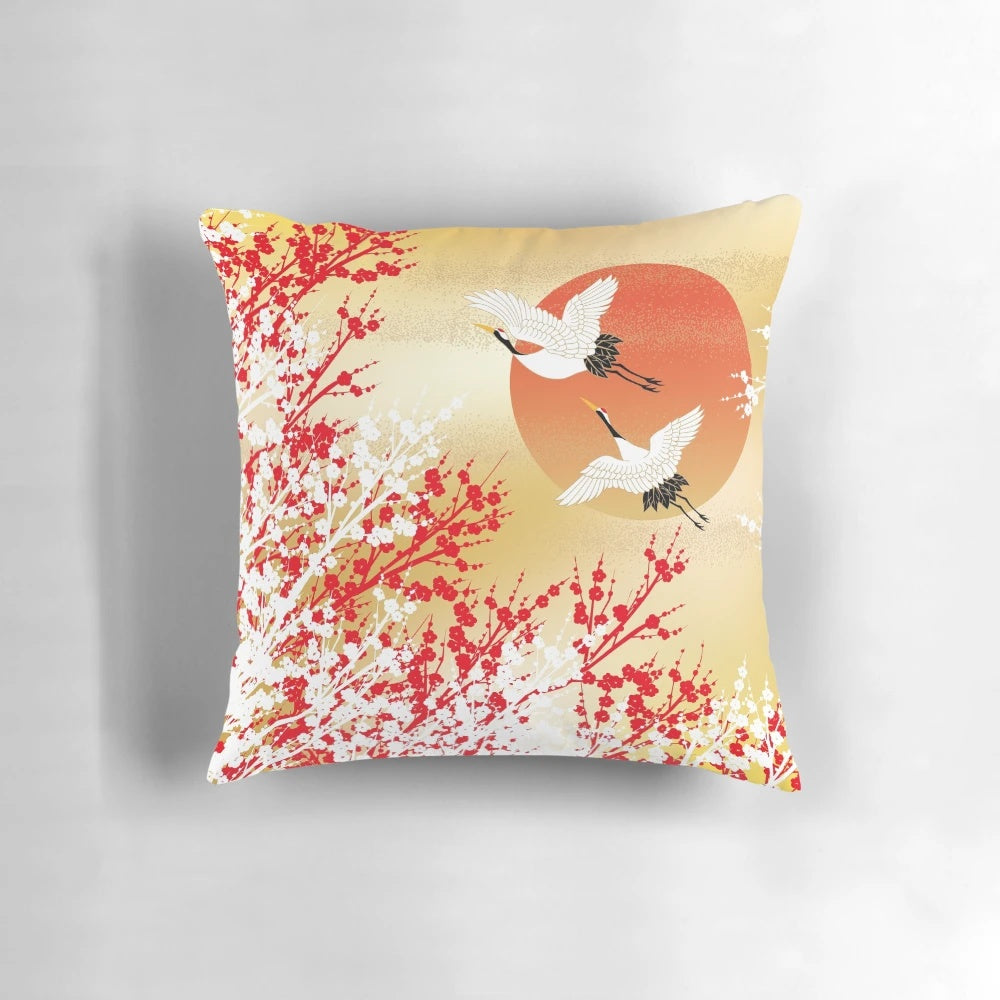 Decorative pillow featuring Japanese-inspired patterns, including sakura, plum flowers, and origami cranes.