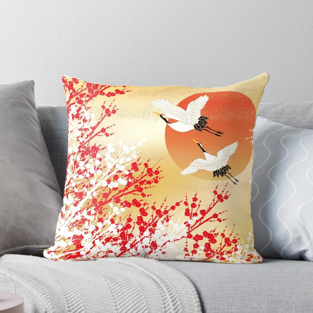 Decorative pillow featuring Japanese-inspired patterns, including sakura, plum flowers, and origami cranes.