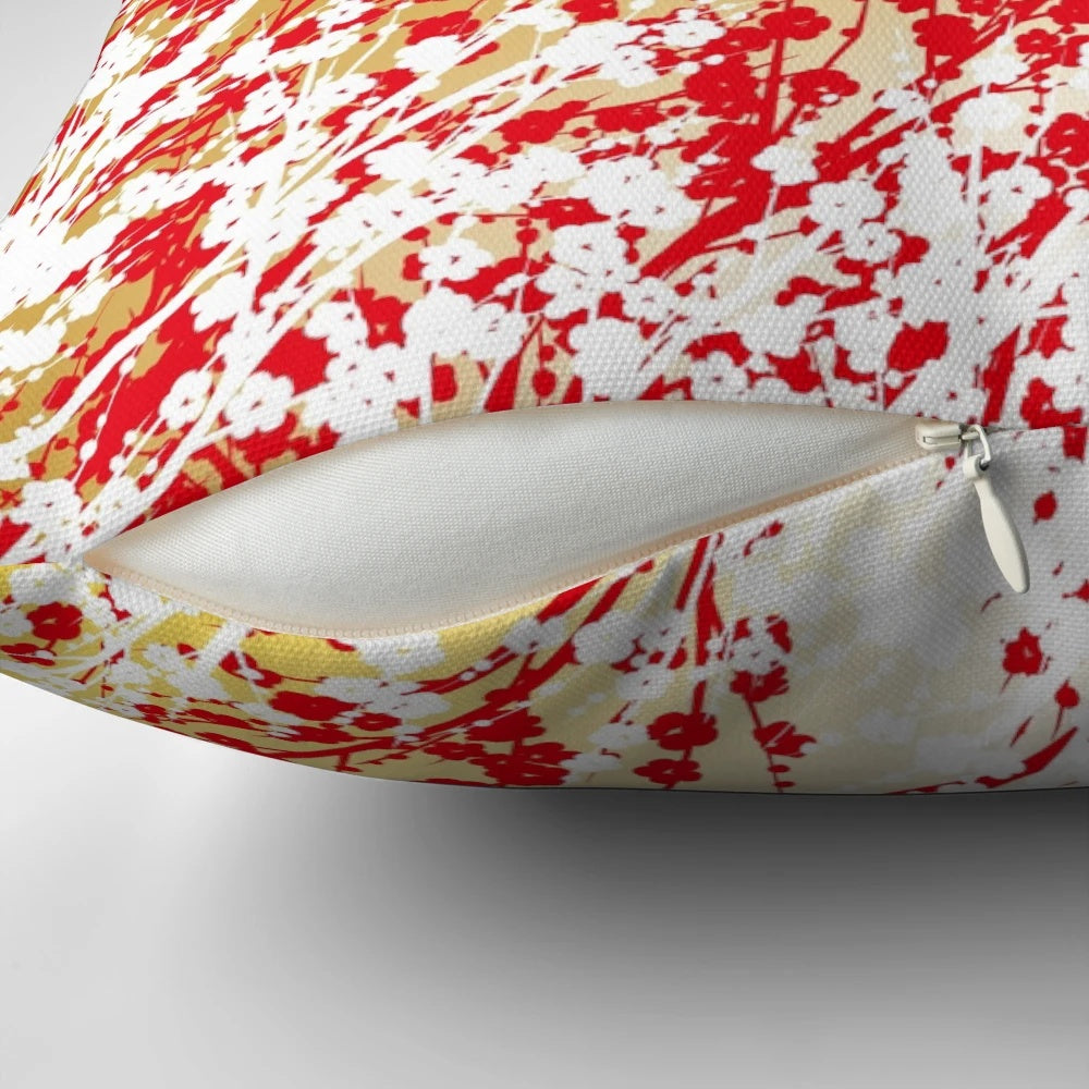 Decorative pillow featuring Japanese-inspired patterns, including sakura, plum flowers, and origami cranes.