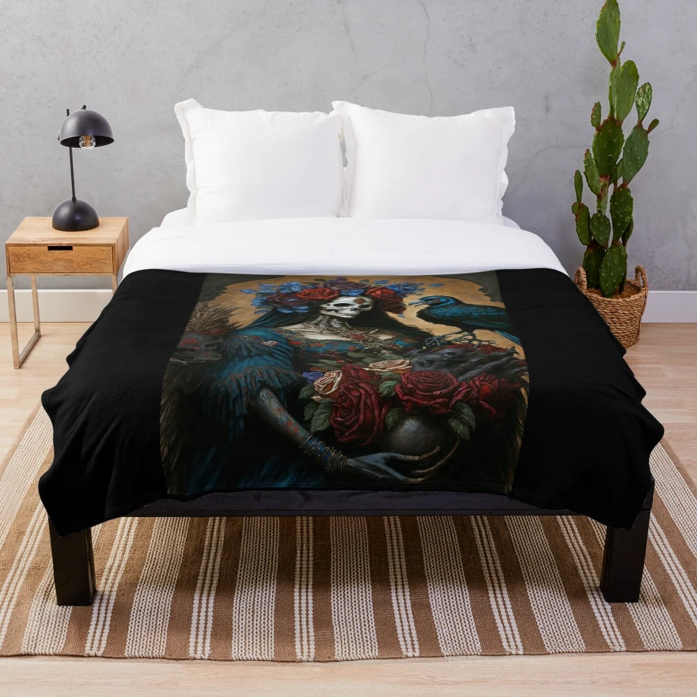 Soft plush blanket featuring the Mexican folk art figure of Santa Muerte, the patron saint of death