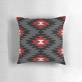 A decorative throw pillow featuring a vibrant and authentic native american tribal design in black, white, red, and grey colors.