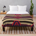 Plush blanket featuring Navajo-inspired indigenous designs