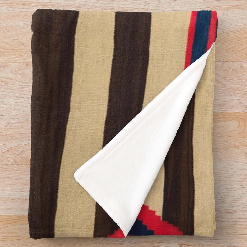 Plush blanket featuring Navajo-inspired indigenous designs