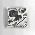 Vibrant and detailed image of a New Zealand native fantail bird on a decorative pillow