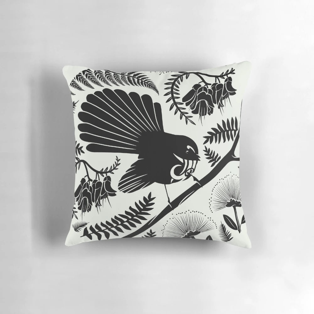 Vibrant and detailed image of a New Zealand native fantail bird on a decorative pillow