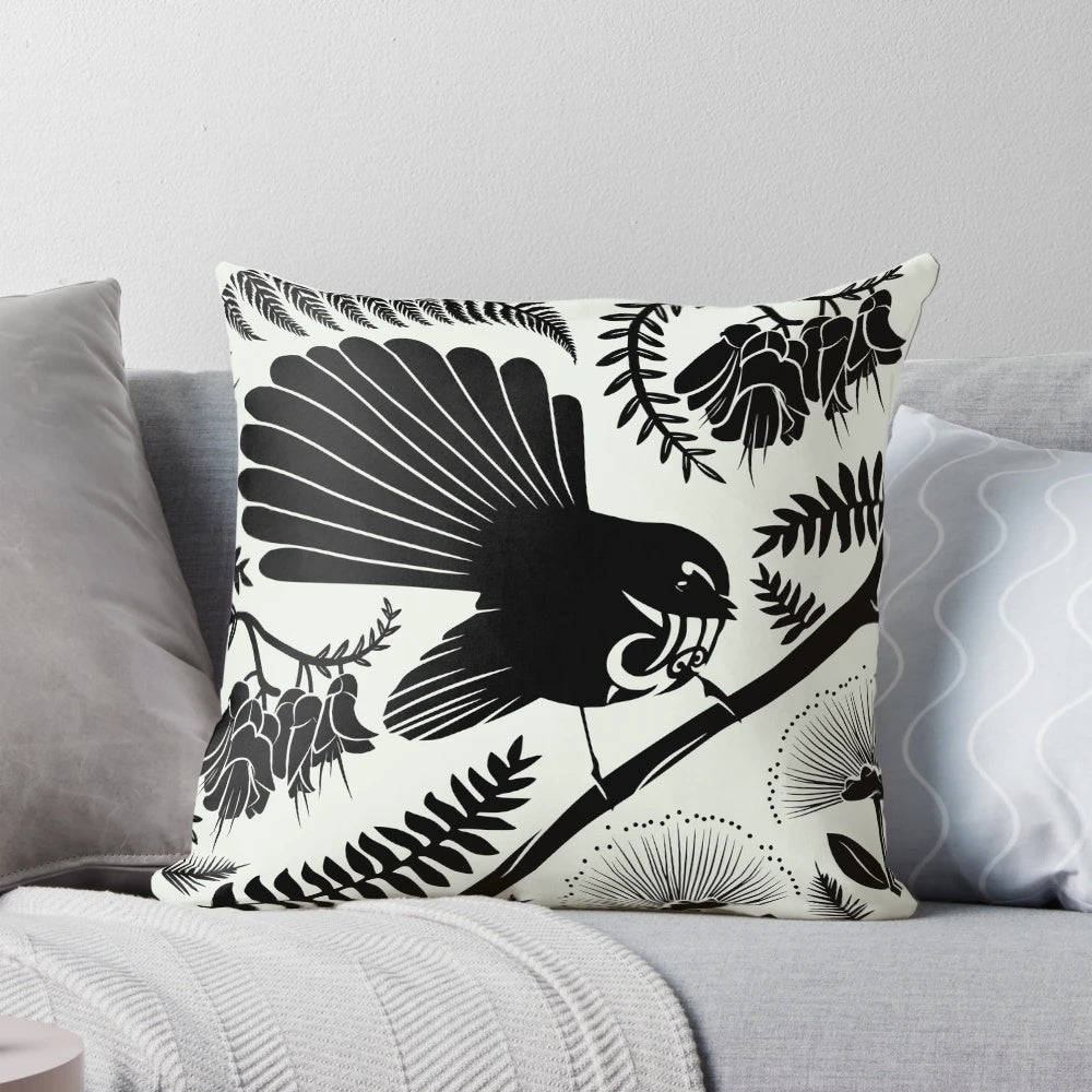 Vibrant and detailed image of a New Zealand native fantail bird on a decorative pillow