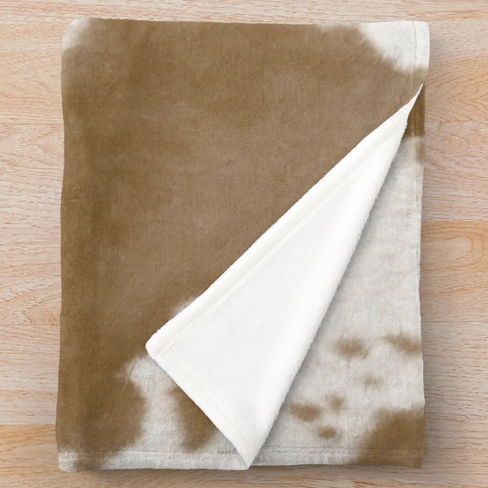 Nguni cattle hide plush blanket with traditional African pattern