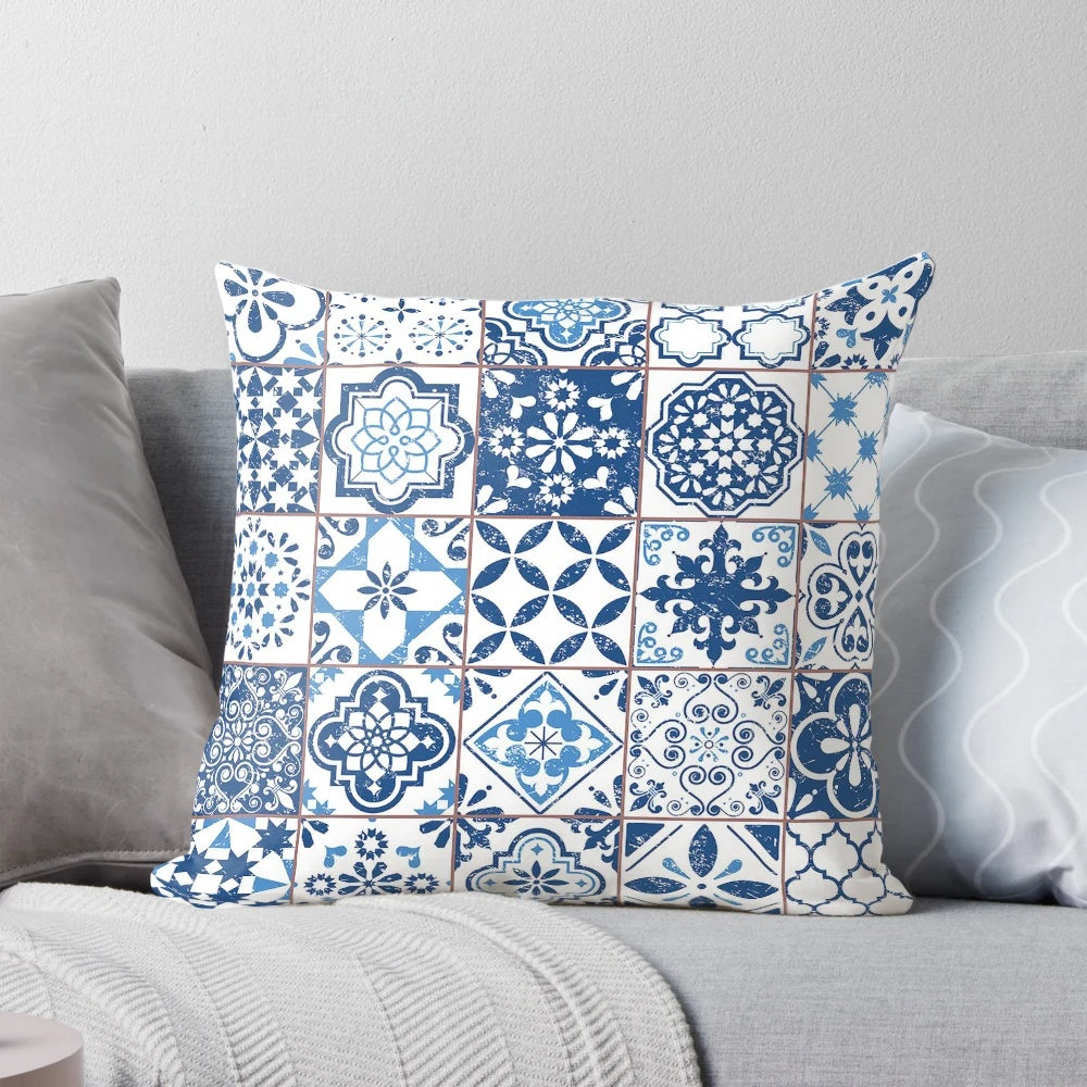 Close-up of a decorative pillow with a vibrant Portuguese azulejo-inspired pattern