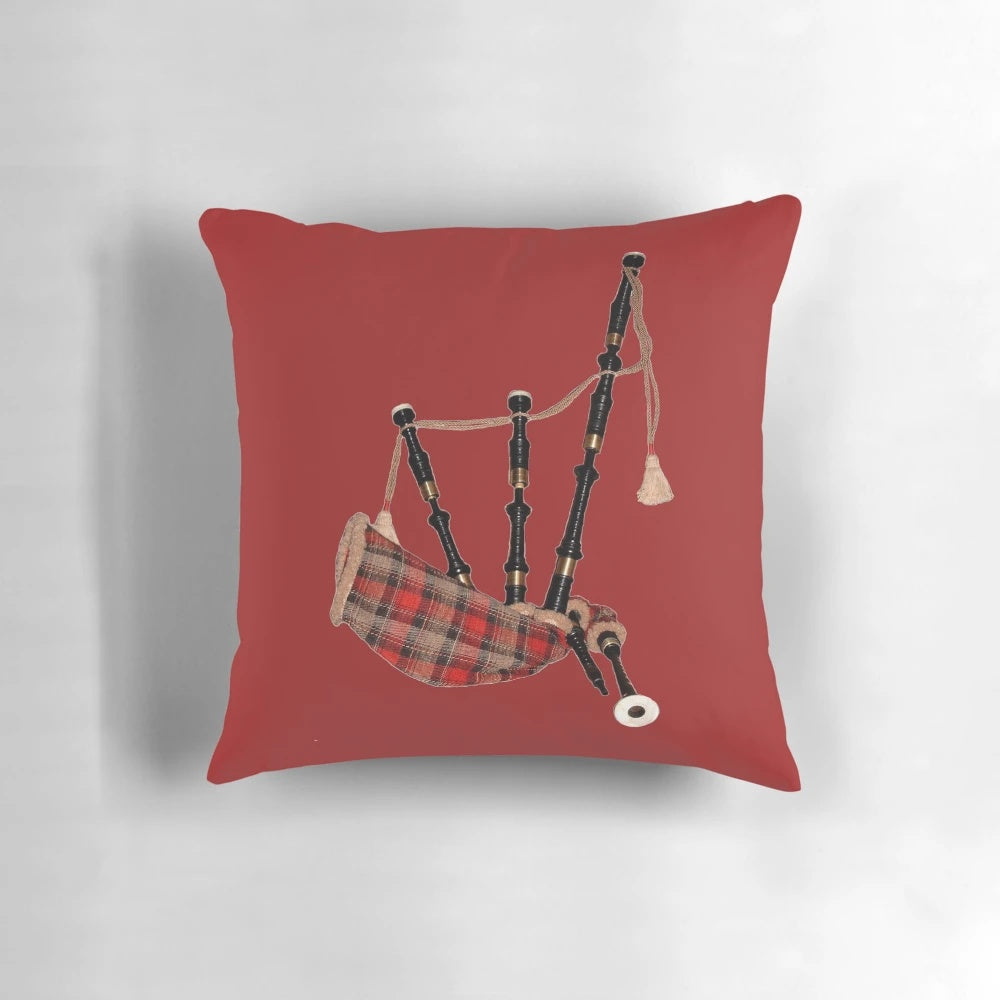 A plush, tartan-patterned pillow featuring a Scottish bagpipe motif, perfect for adding a touch of Scottish pride to your home.